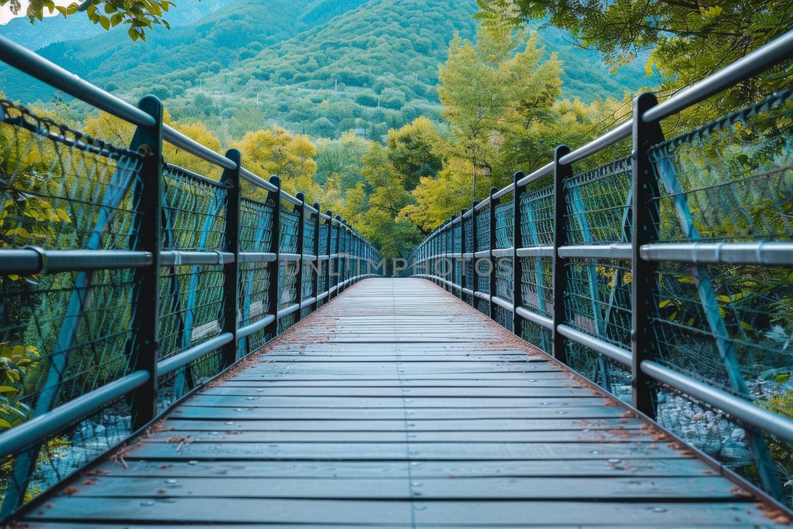 A serene view of a rural wooden bridge connecting village houses, surrounded by lush greenery and a calm river under a cloudy sky.