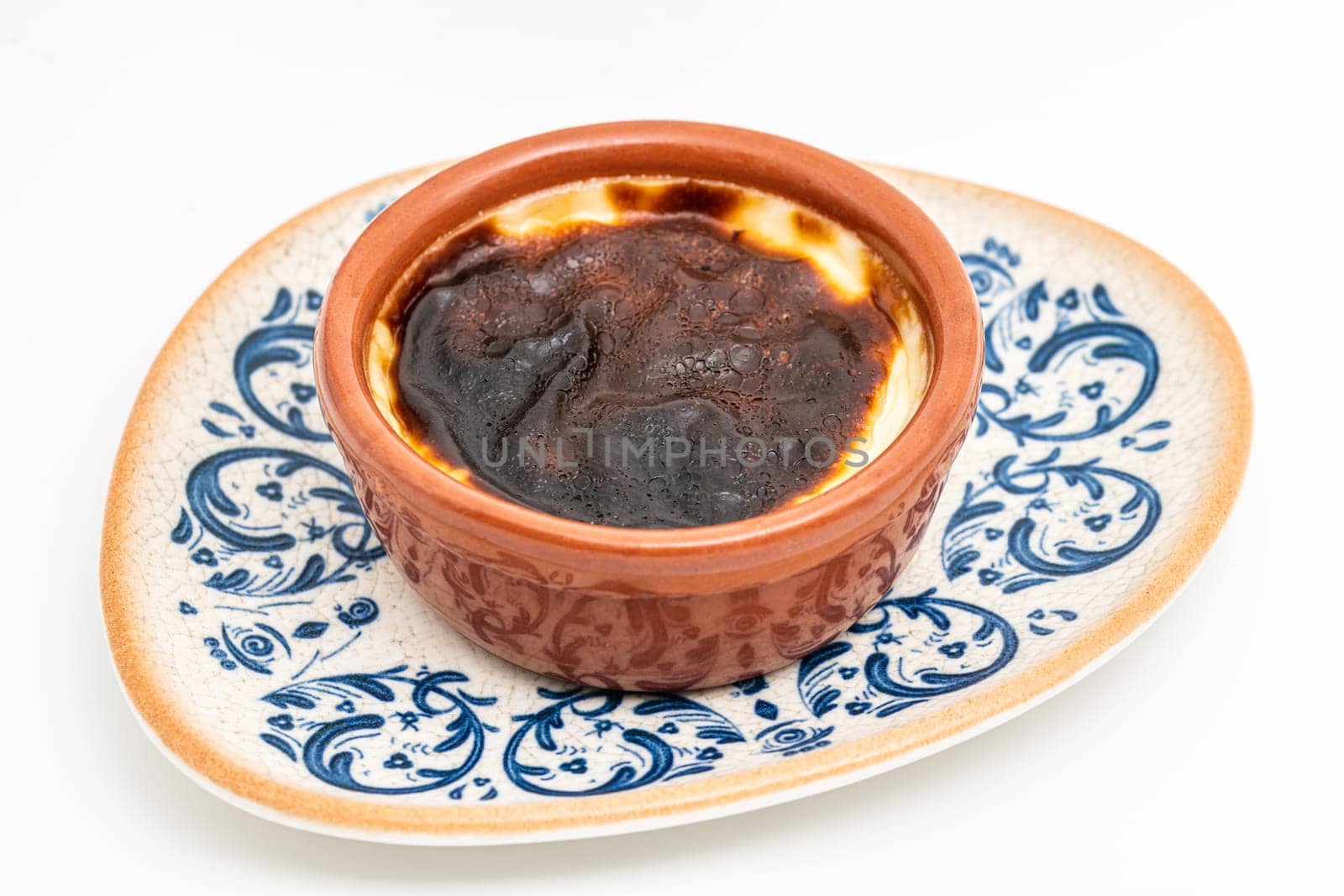 Traditional turkish dessert bakery rice pudding Turkish name Firin Sutlac in ceramic bowl by Sonat