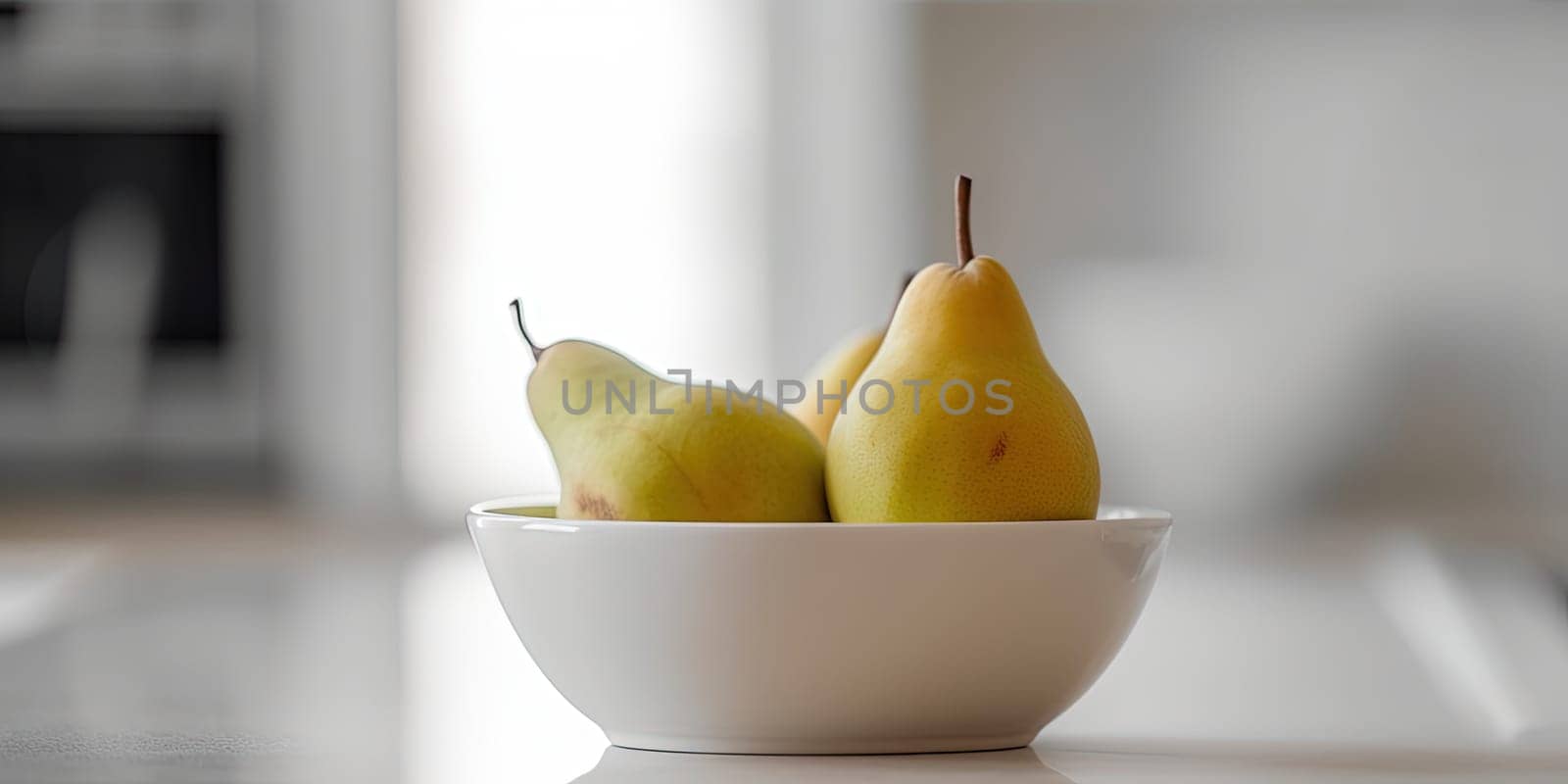 Pears in a bowl on the kitchen table on a blurred background by GekaSkr