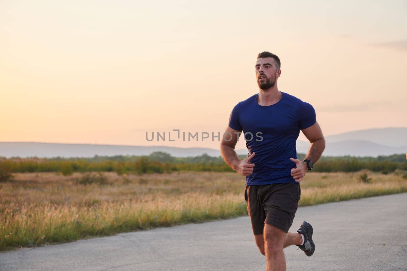 A dedicated marathon runner pushes himself to the limit in training. by dotshock