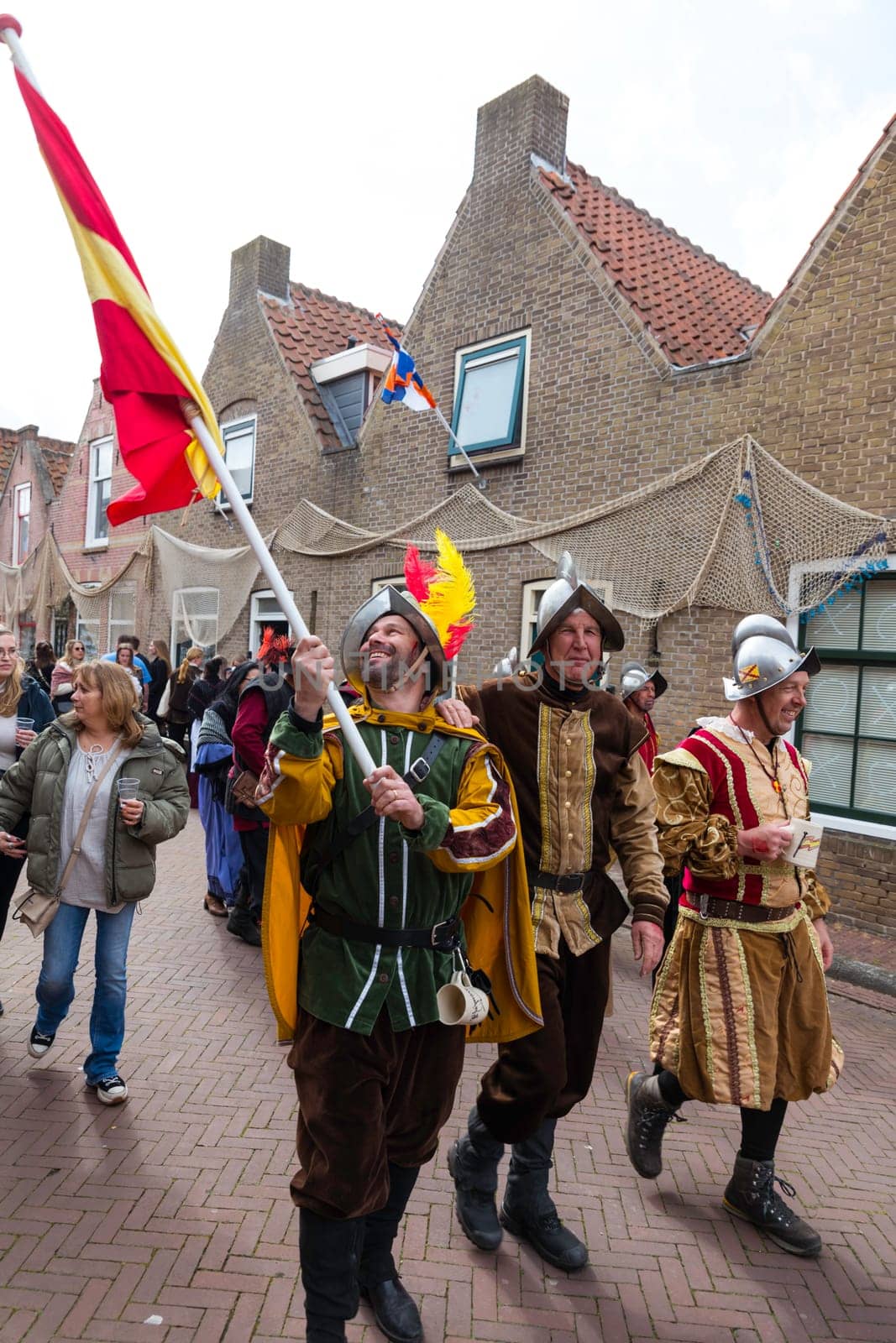 Brielle,Holland,1-04-2024:people with the spanish flag in traditional traditional costumes celebration of the the first town to be liberated from the Spanish in Den Briel in the Netherlands in 1572