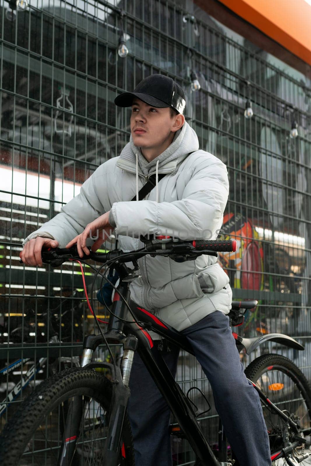 A man in a cap rented a bicycle.
