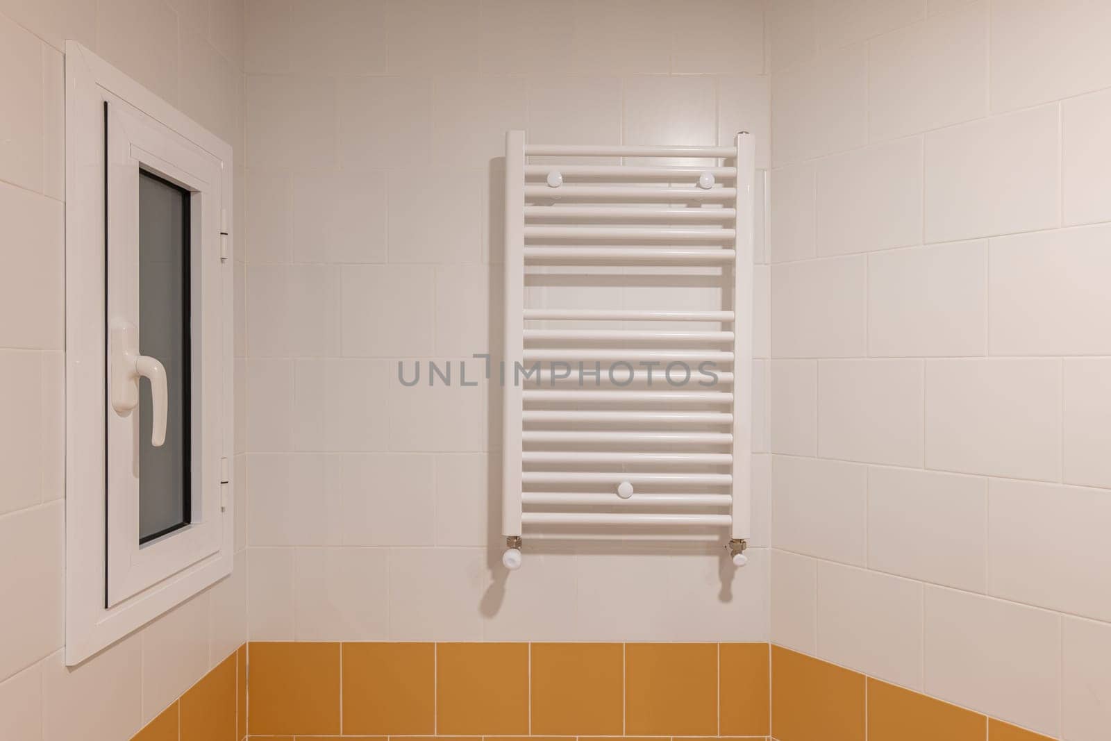 A Bathroom With Orange Tiles And A White Towel Rack by apavlin