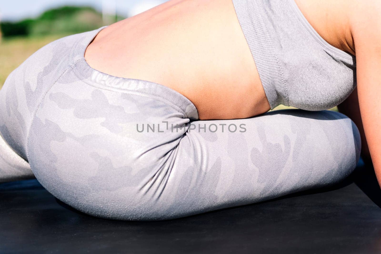 woman doing stretching yoga exercises by raulmelldo