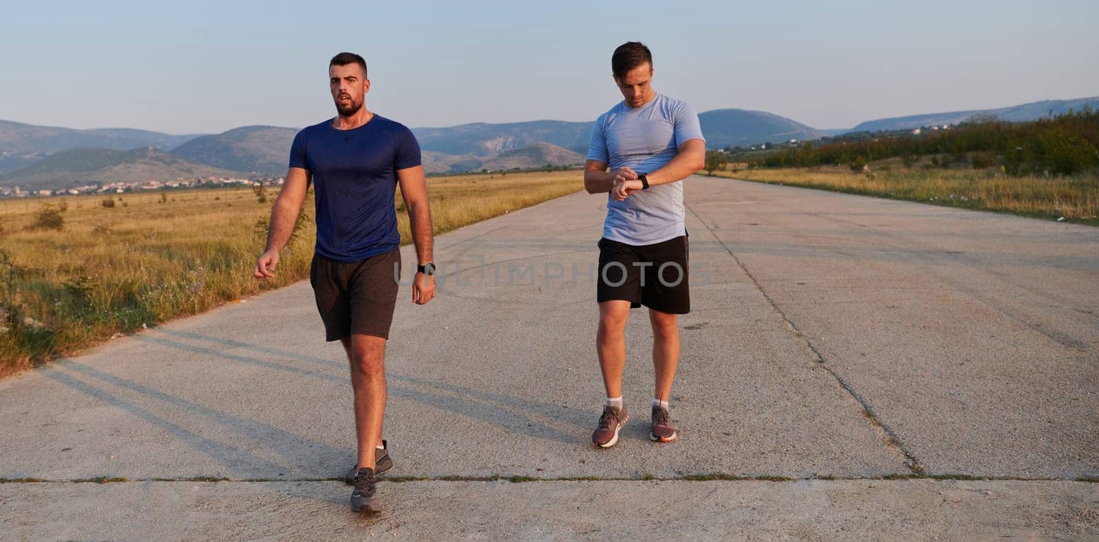 In anticipation of an upcoming marathon competition, two athletic friends train side by side, embodying the spirit of teamwork, dedication, and mutual support in their shared fitness journey.