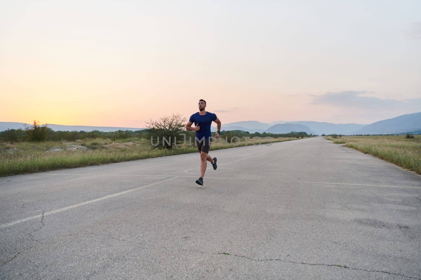 A highly motivated marathon runner displays unwavering determination as he trains relentlessly for his upcoming race, fueled by his burning desire to achieve his goals.