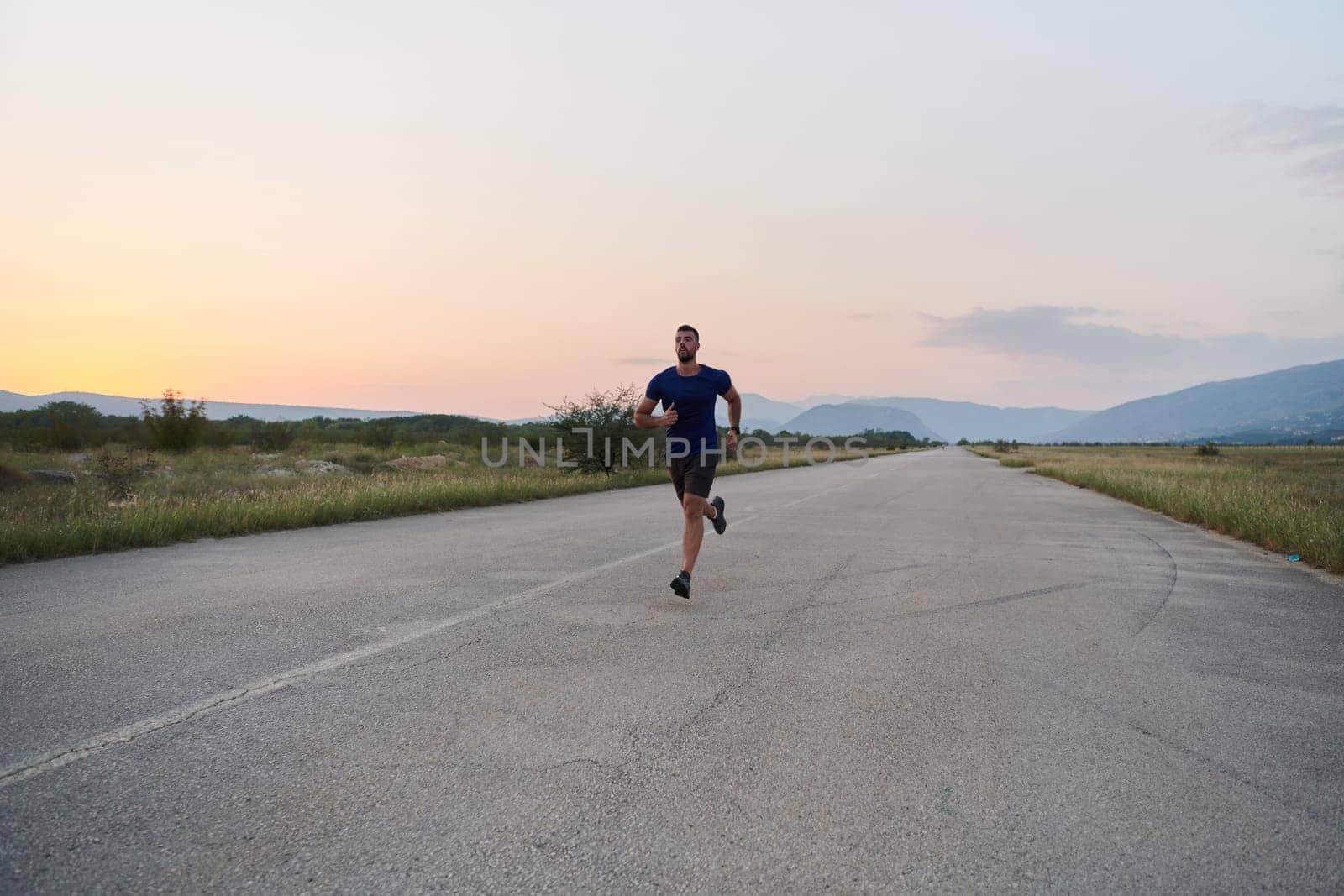 A highly motivated marathon runner displays unwavering determination as he trains relentlessly for his upcoming race, fueled by his burning desire to achieve his goals.