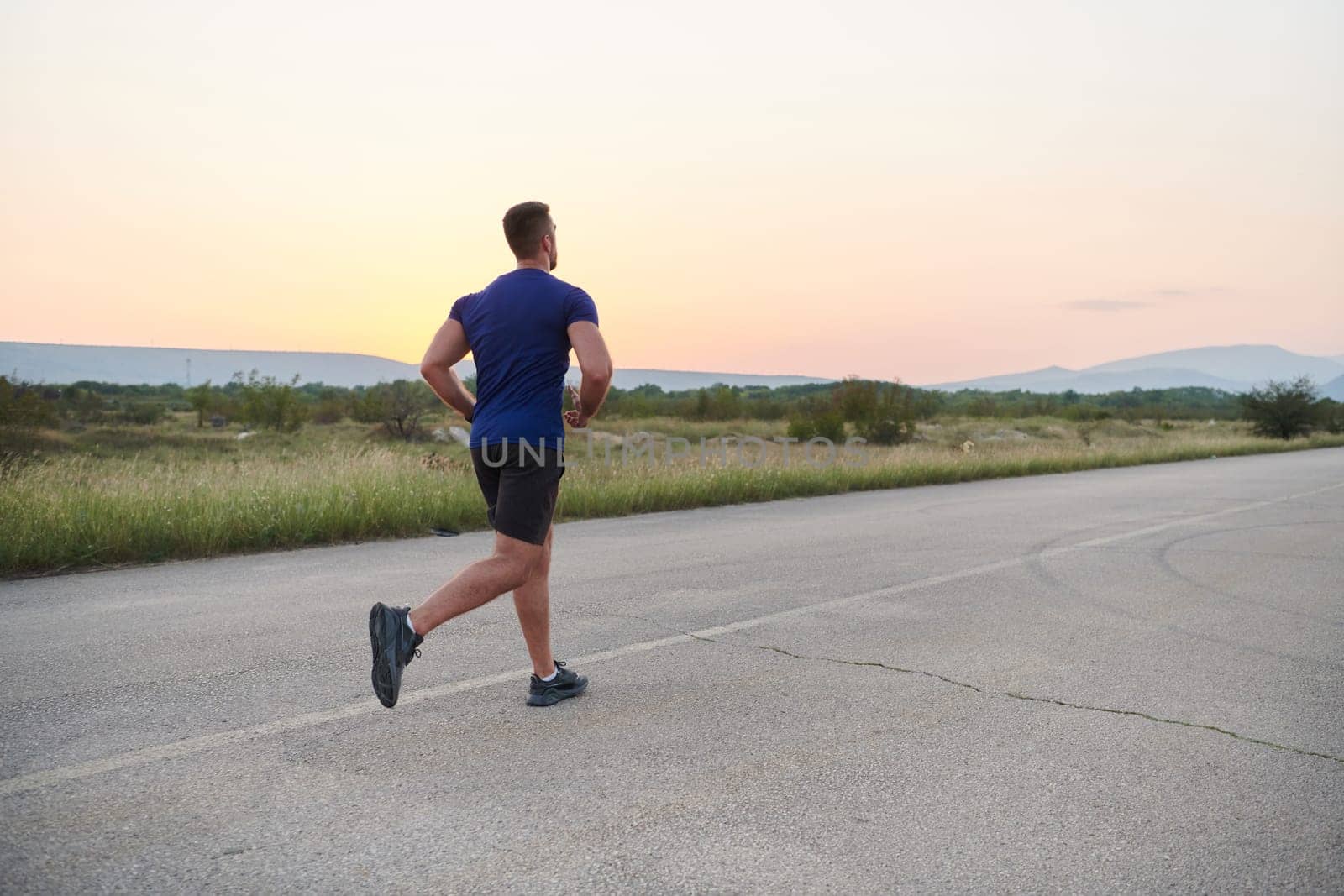 A dedicated marathon runner pushes himself to the limit in training. by dotshock