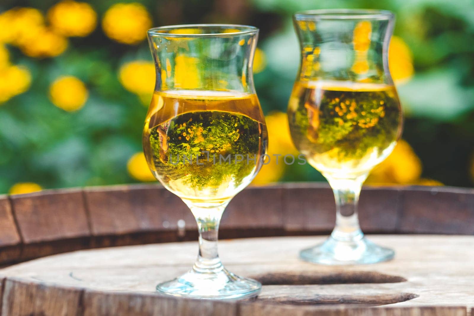 cider in glasses stands on a barrel by drakuliren