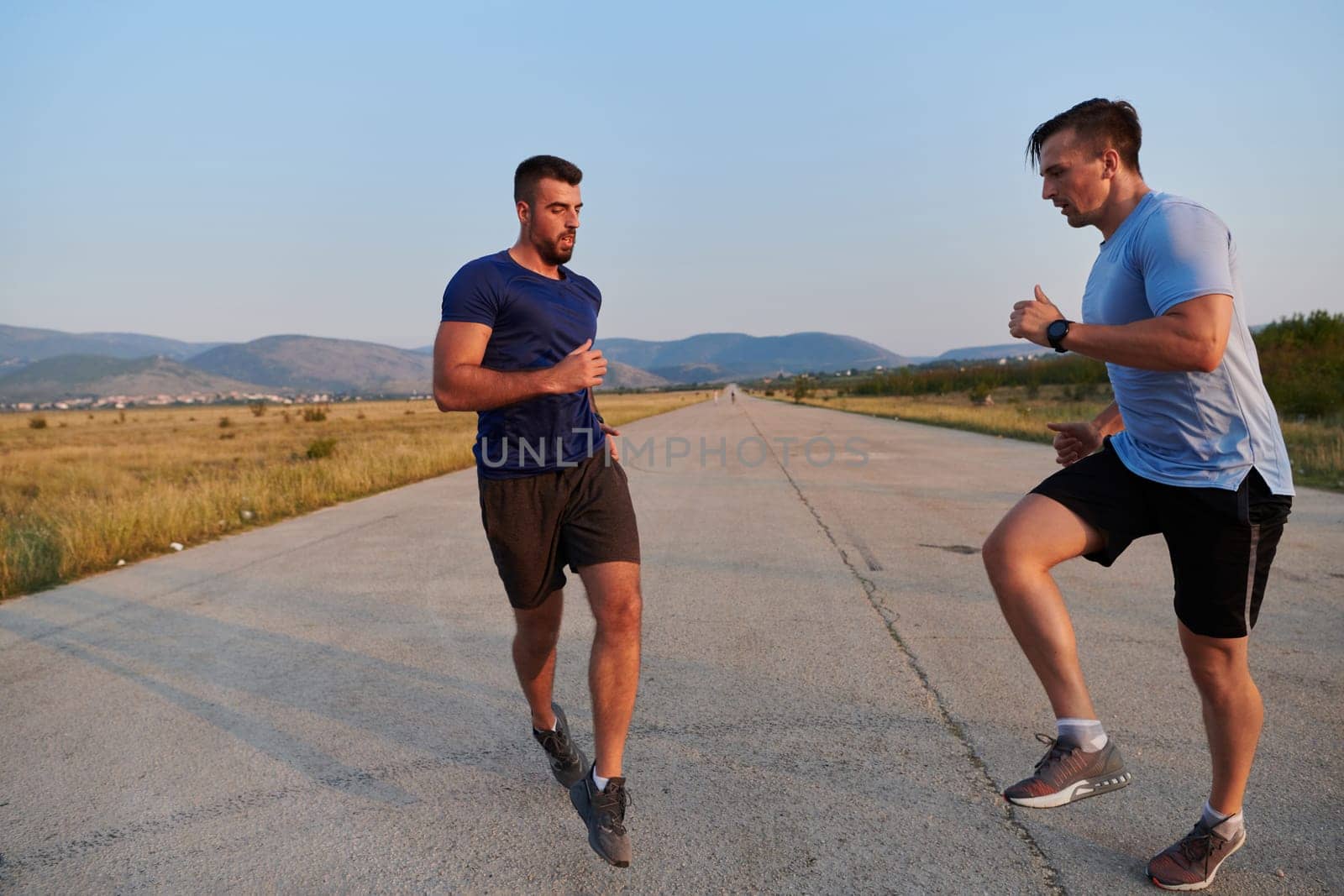 In anticipation of an upcoming marathon competition, two athletic friends train side by side, embodying the spirit of teamwork, dedication, and mutual support in their shared fitness journey.