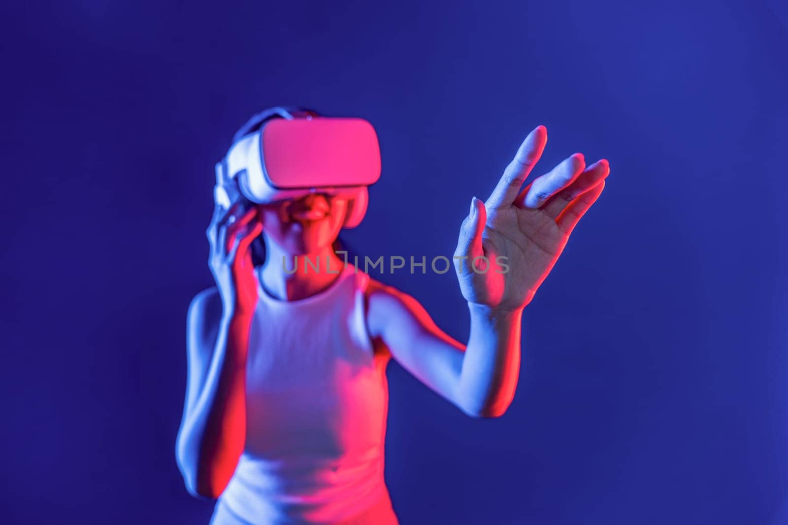 Elegant female connect metaverse using hand touch virtual object. Hallucination. by biancoblue