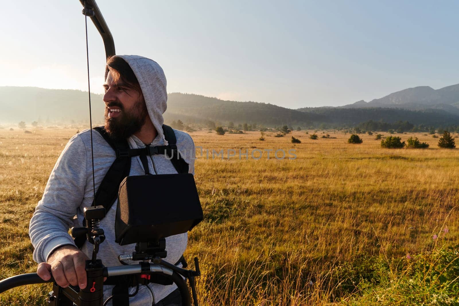 Misty Morning Capture: Videographer Ready to Film Beautiful Meadow Scenes. by dotshock