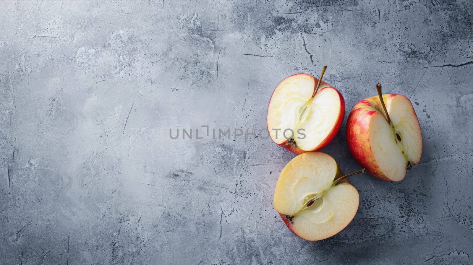 Sliced apple and whole apples on a textured gray background AI