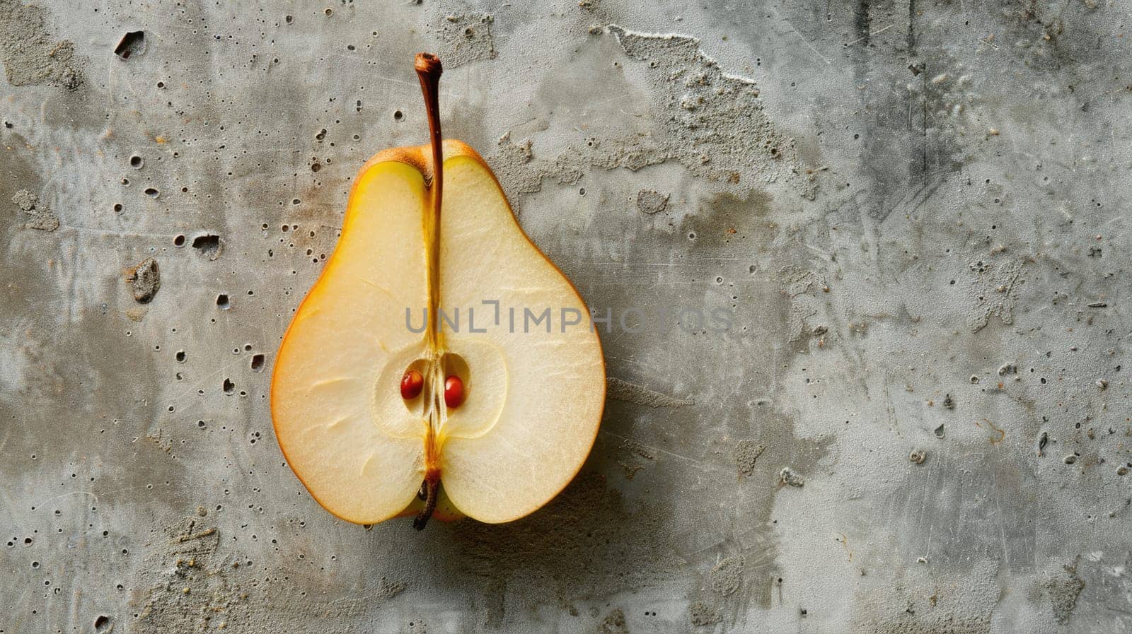 Sliced pear on a textured gray background by natali_brill