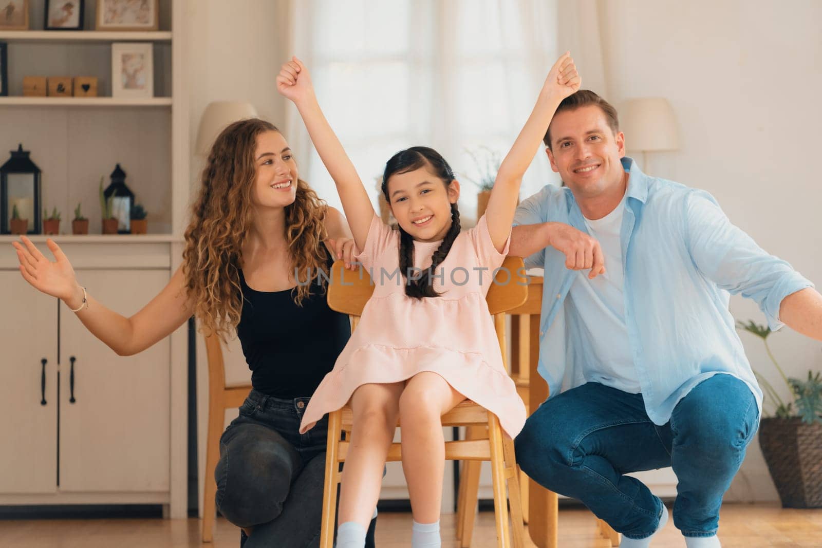 Happy family portrait with little girl smiling, looking at camera. Synchronos by biancoblue