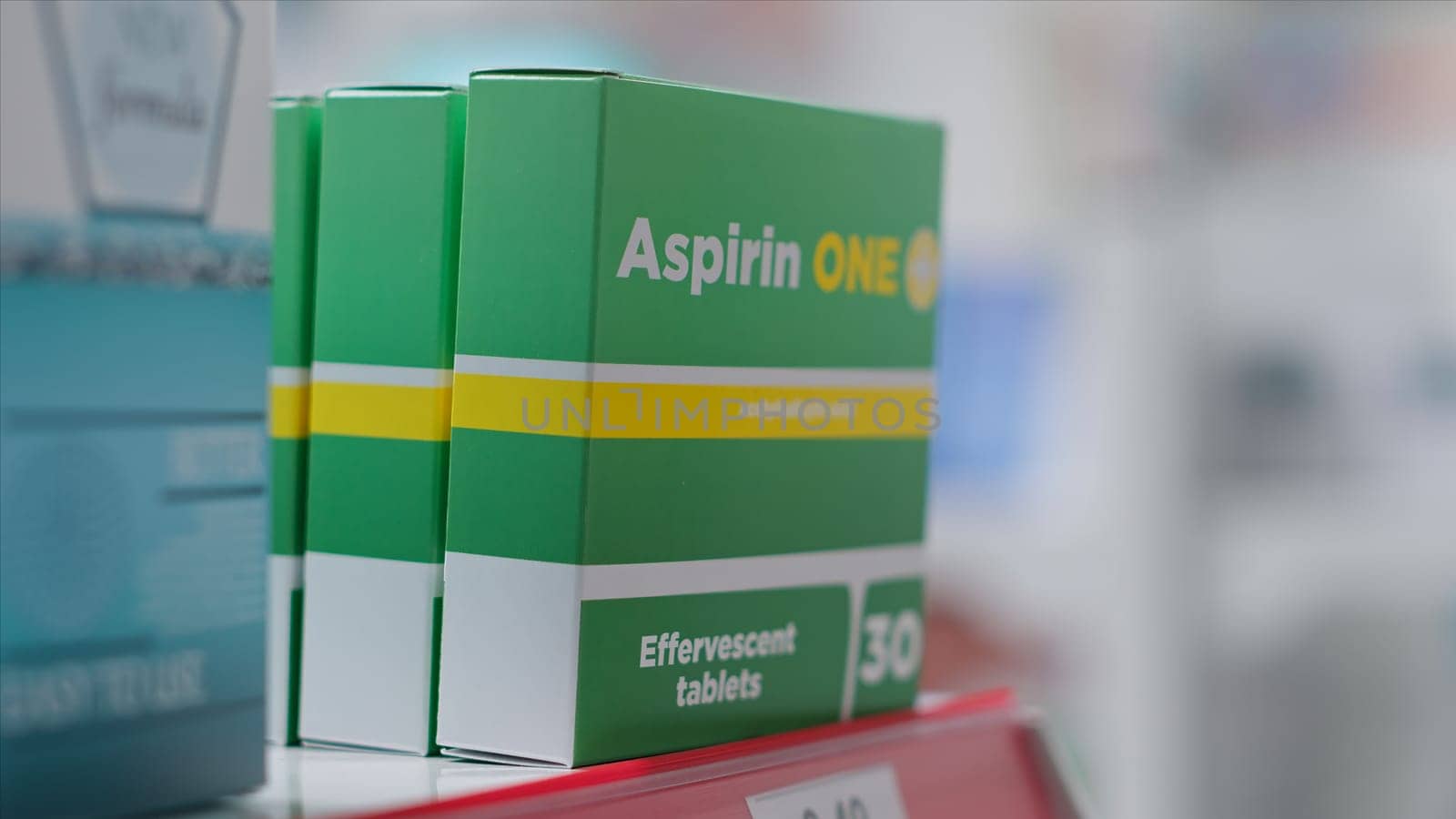 Selective focus of supplements packages on display at medical store, boxes of prescription pills or natural pharmaceutics for sale. Variety of medicaments and nutrients in empty pharmacy.