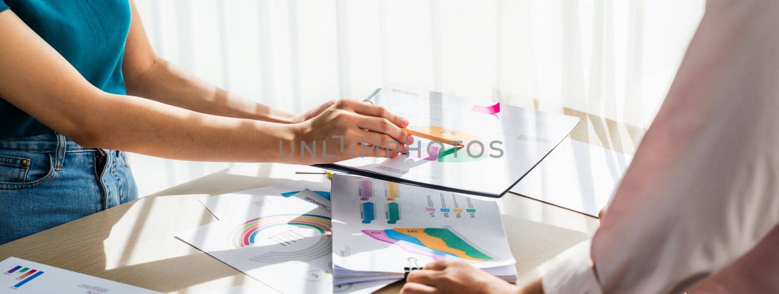 Startup company employee working together, analyzing BI dashboard paper on financial data report and planning strategic marketing for business success in panorama banner. Synergic