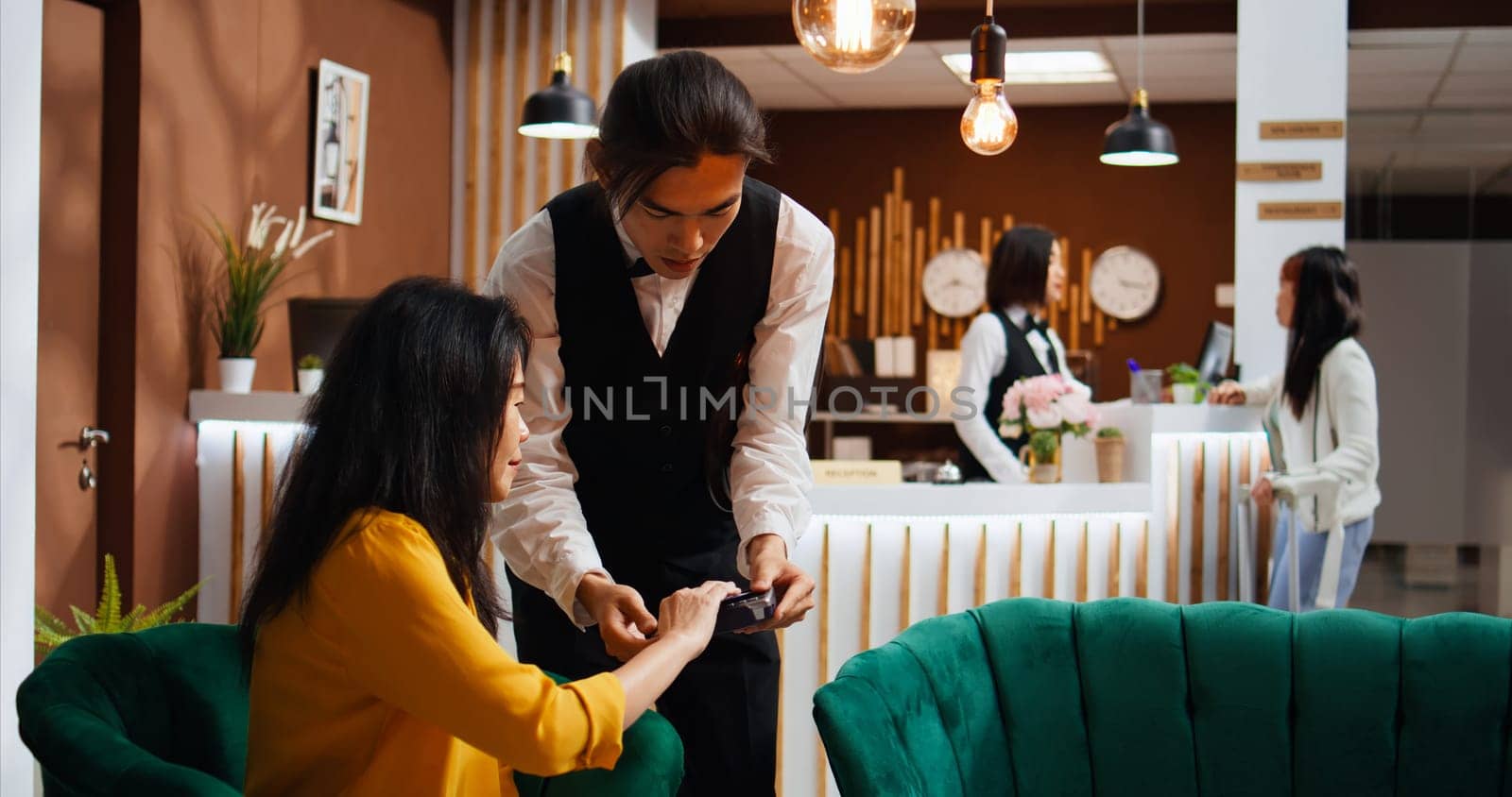 Hotel guest paying for drink and giving cash to worker by DCStudio