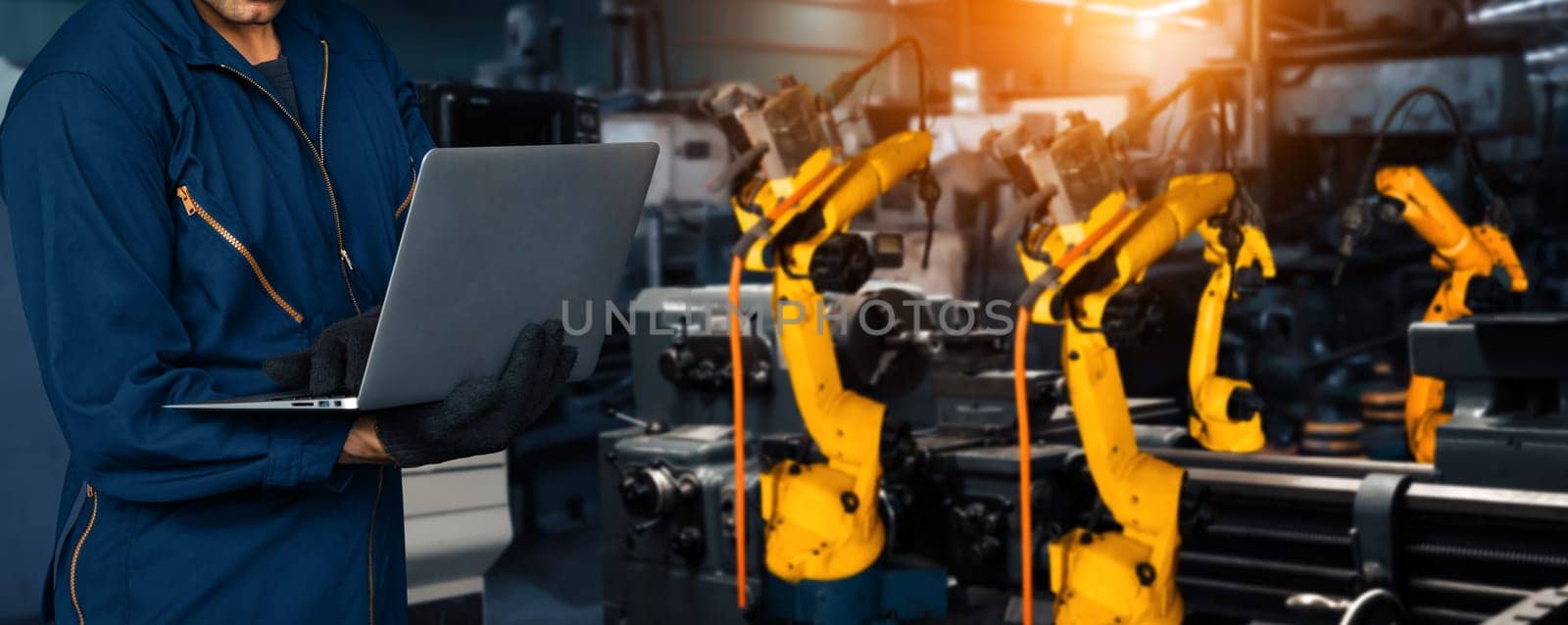 XAI Engineer use advanced robotic software to control industry robot arm in factory by biancoblue