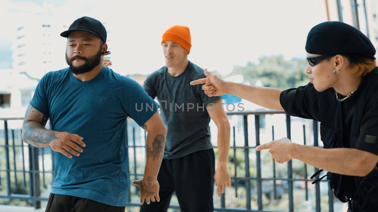 Hipster perform break dancing while partner dancing together at corridor, modern mall. Hip-hop music dancer practice footstep and move to music. Outdoor sport 2024. Active, energetic dance. Endeavor.