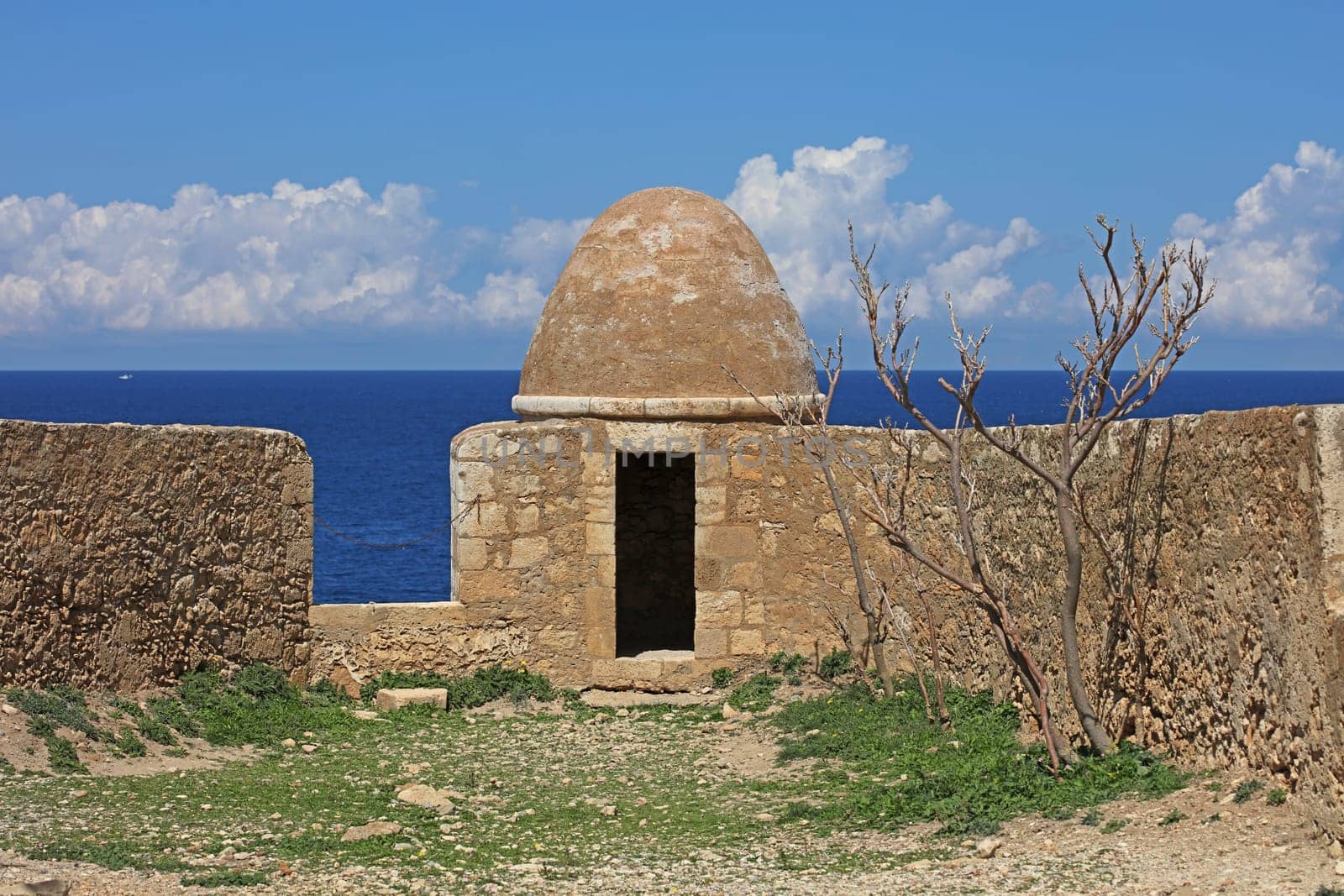 Fortezza fortress castle in Crete island holidays exploring the old ancient stone city monuments close up summer background carnival season high quality big size printings