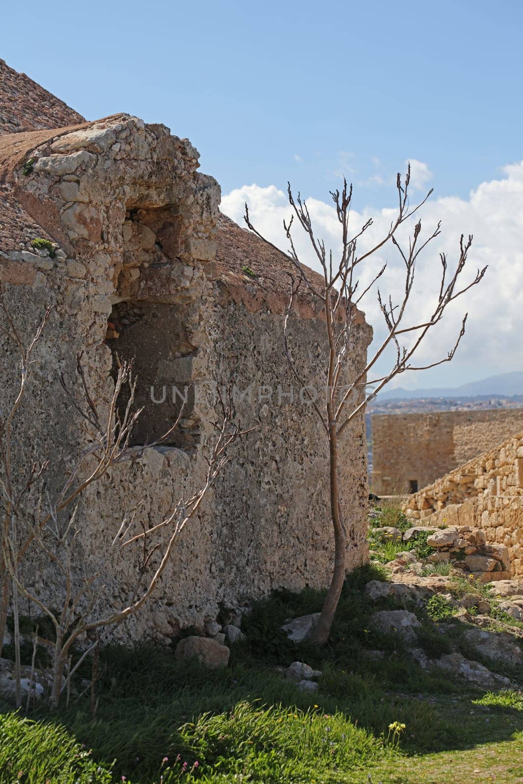 Fortezza fortress castle in Crete island holidays exploring the old ancient stone city monuments close up summer background carnival season high quality big size printings