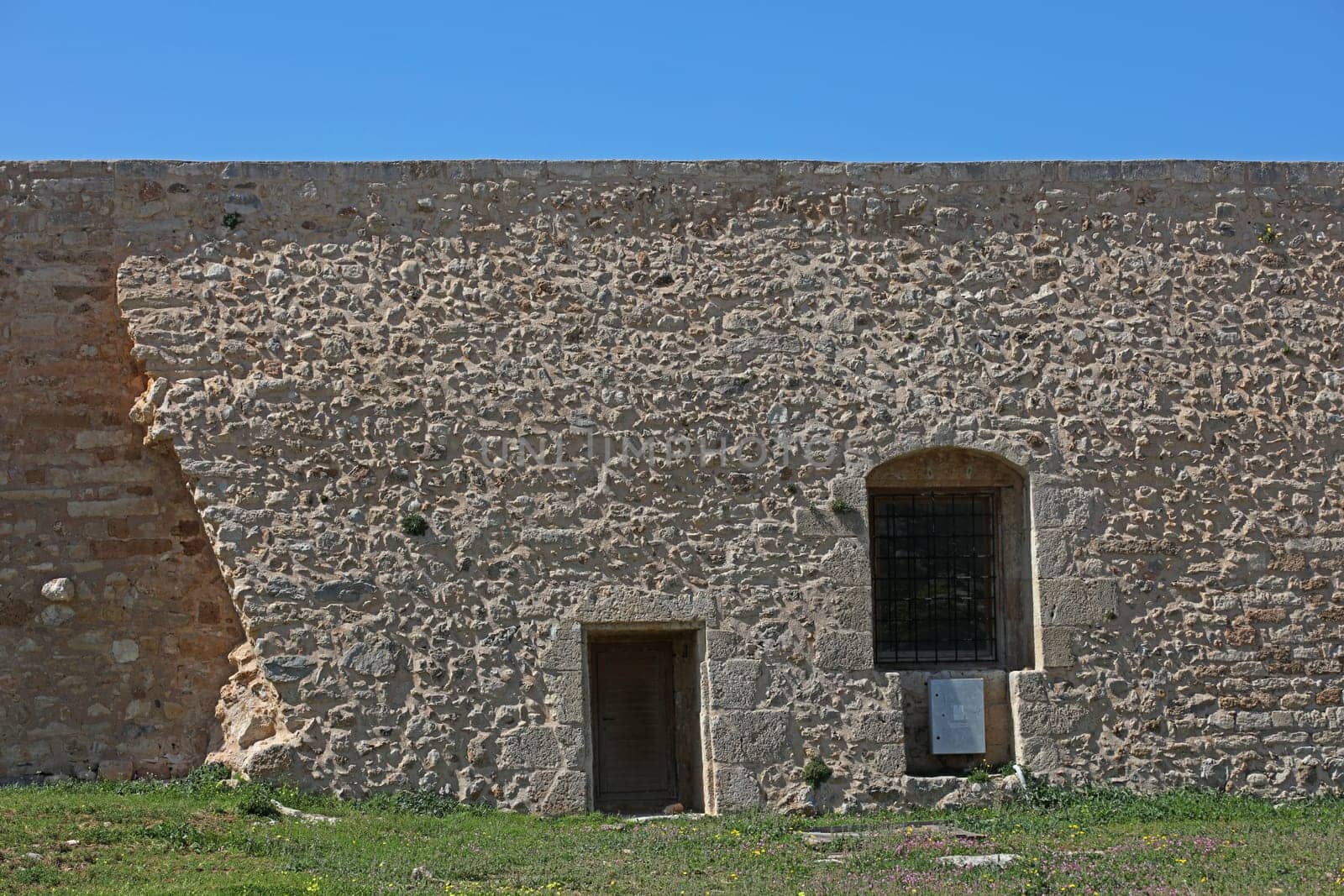 Fortezza fortress castle in Crete island Rethimno holidays exploring the old ancient stone city monuments close up summer background carnival season high quality big size printings