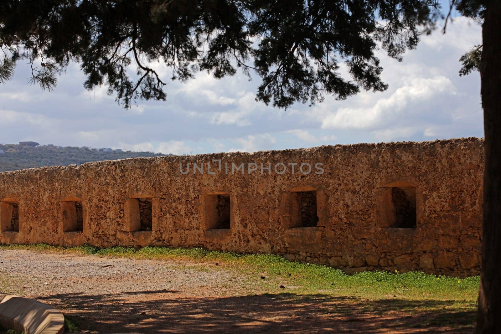 Fortezza fortress castle in Crete island Rethimno holidays exploring the old ancient stone city monuments close up summer background carnival season high quality big size printings