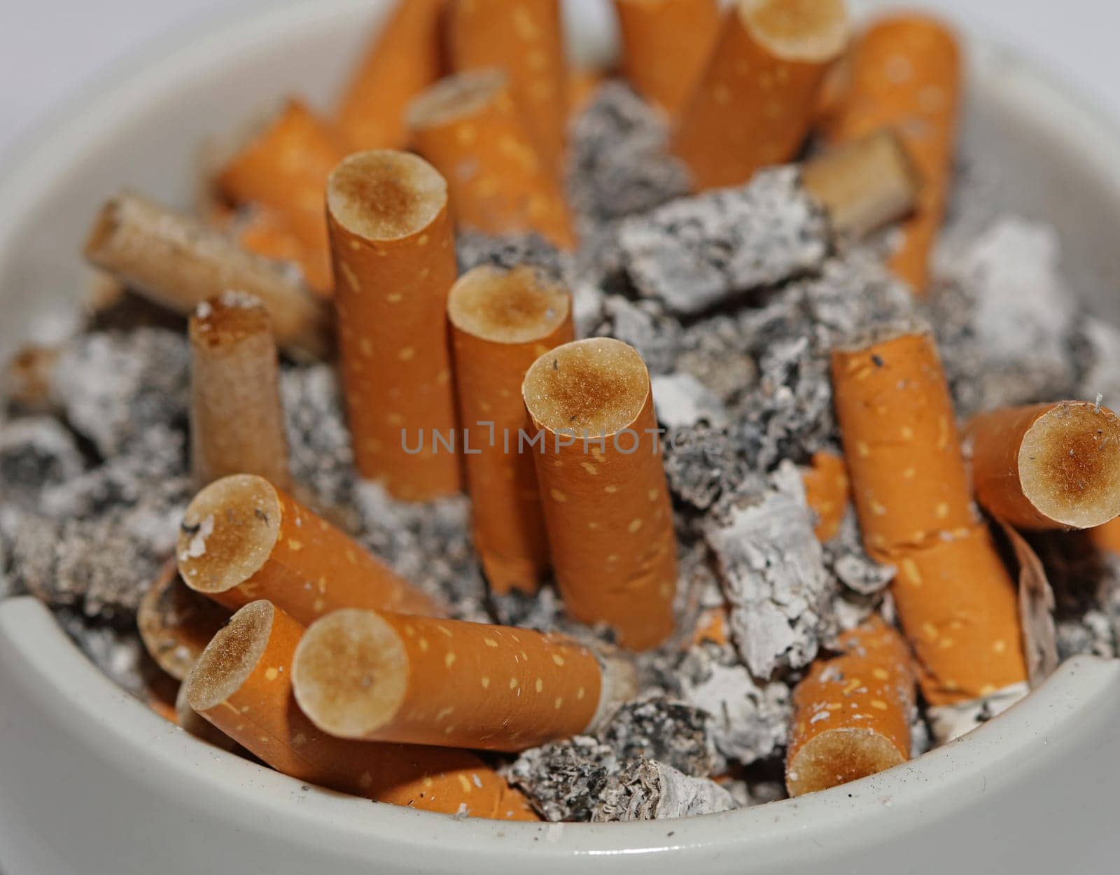 Full ashtray of cigarettes close up macro view smoking habits hi-res stock photography and images high quality big size instant download by BakalaeroZz