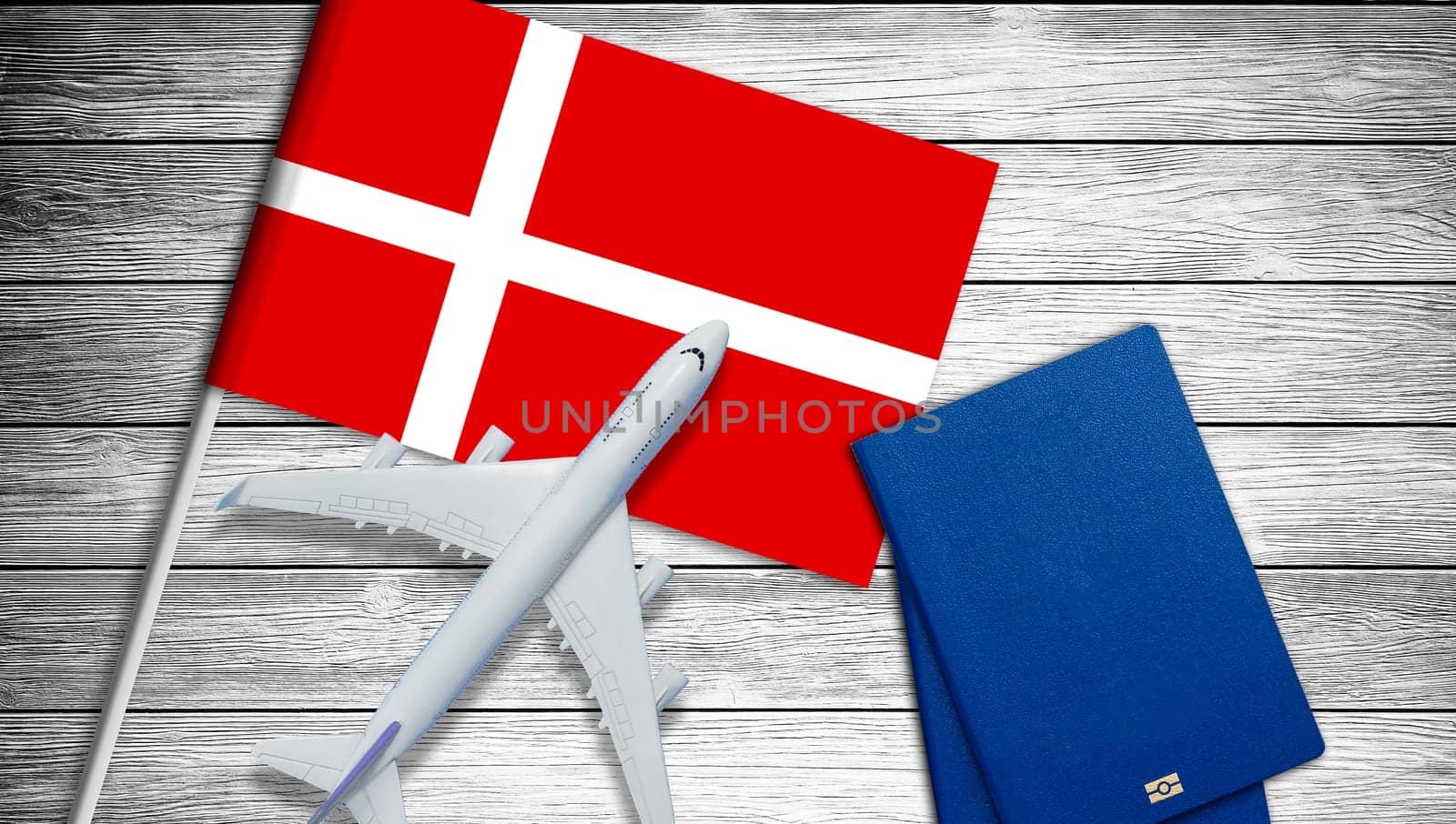 Traveling to Denmark, top view passenger plane on Denmark flag by Andelov13