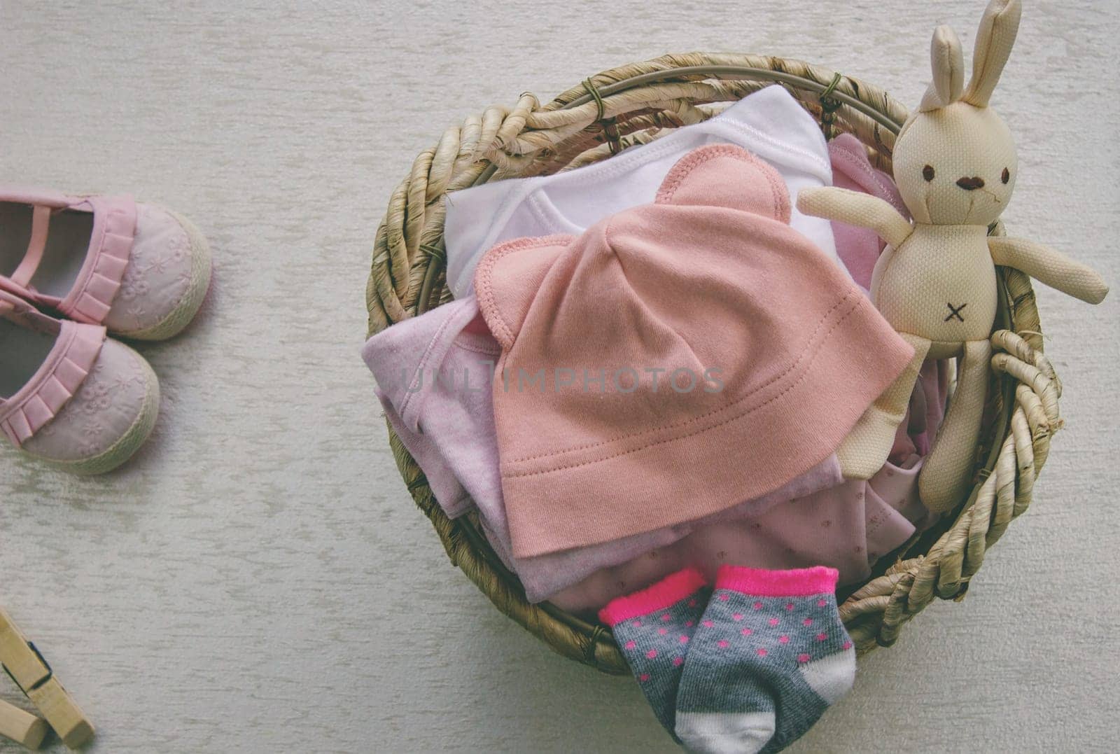 children's things in the basket. washing children's clothes