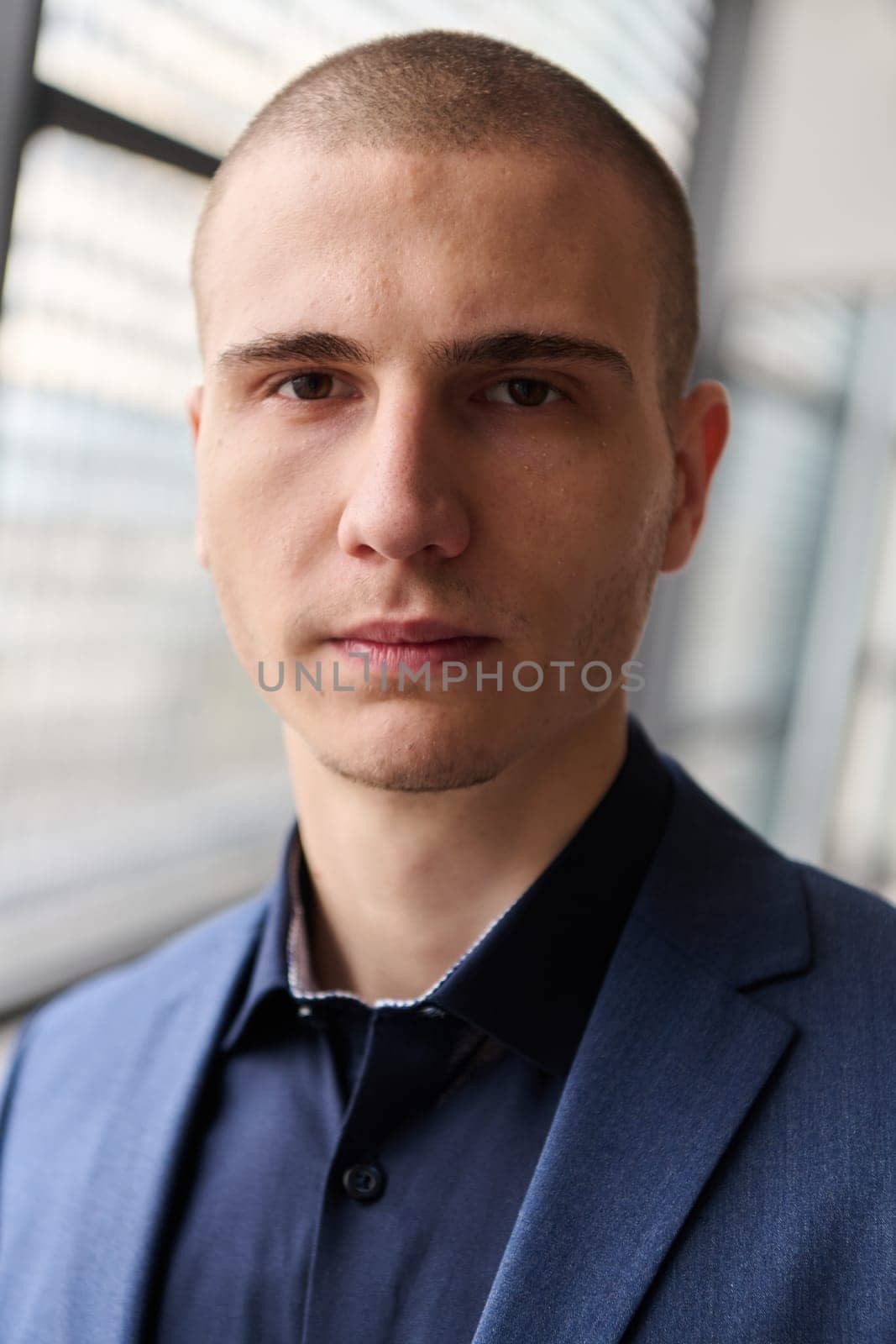 A young successful businessman entrepreneur in a modern conference setting