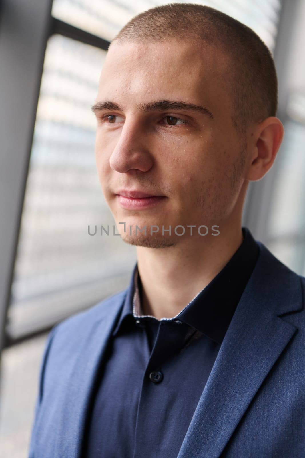 A young successful businessman entrepreneur in a modern conference setting