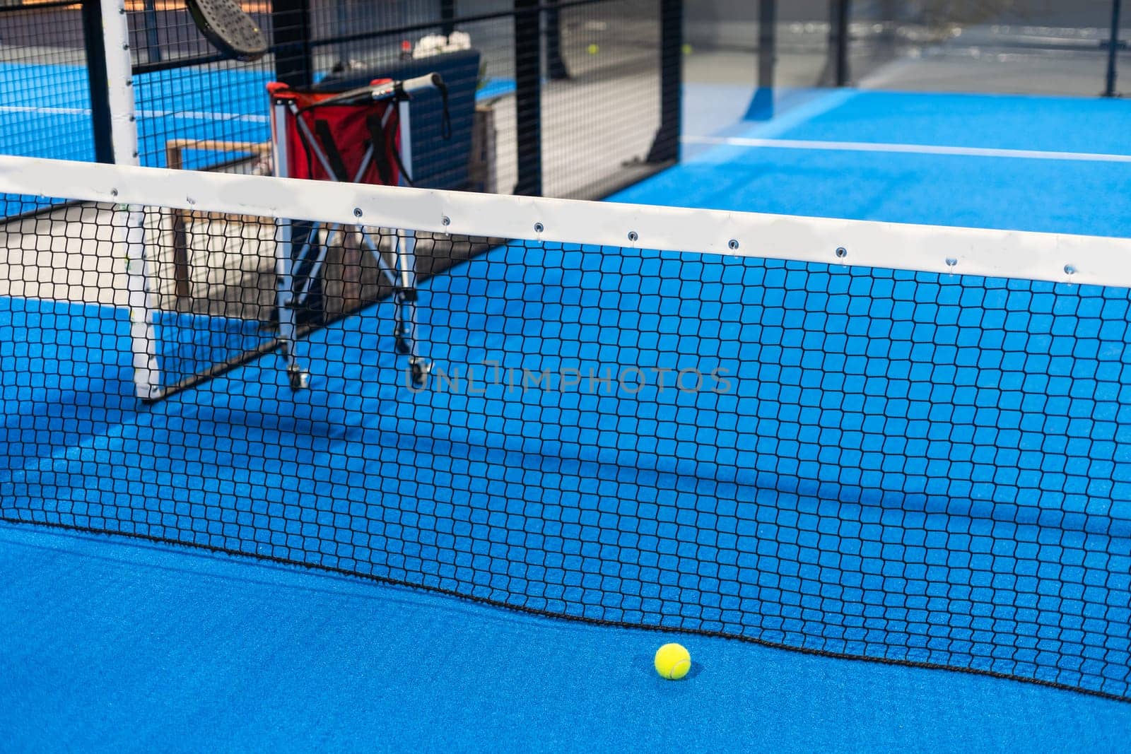 Paddle objects on blue court. High quality photo
