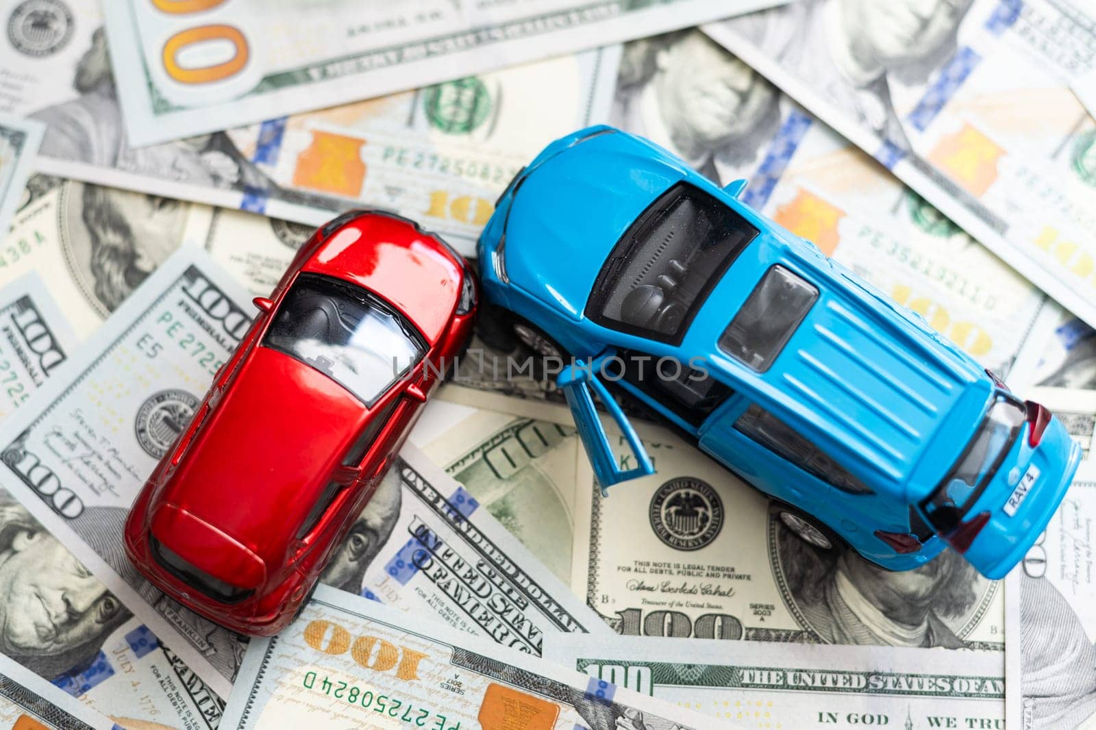 Toy Cars Put on american banknotes.Concept of saving Money to buy and insurance new car. by Andelov13
