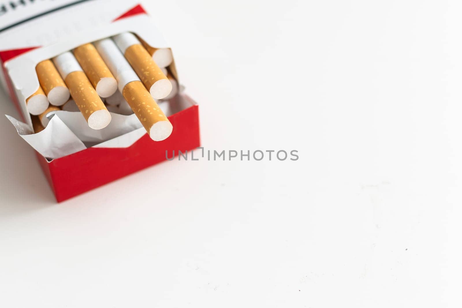 Open blue pack of cigarettes isolated on white background. Box of cigarettes closeup. by Andelov13