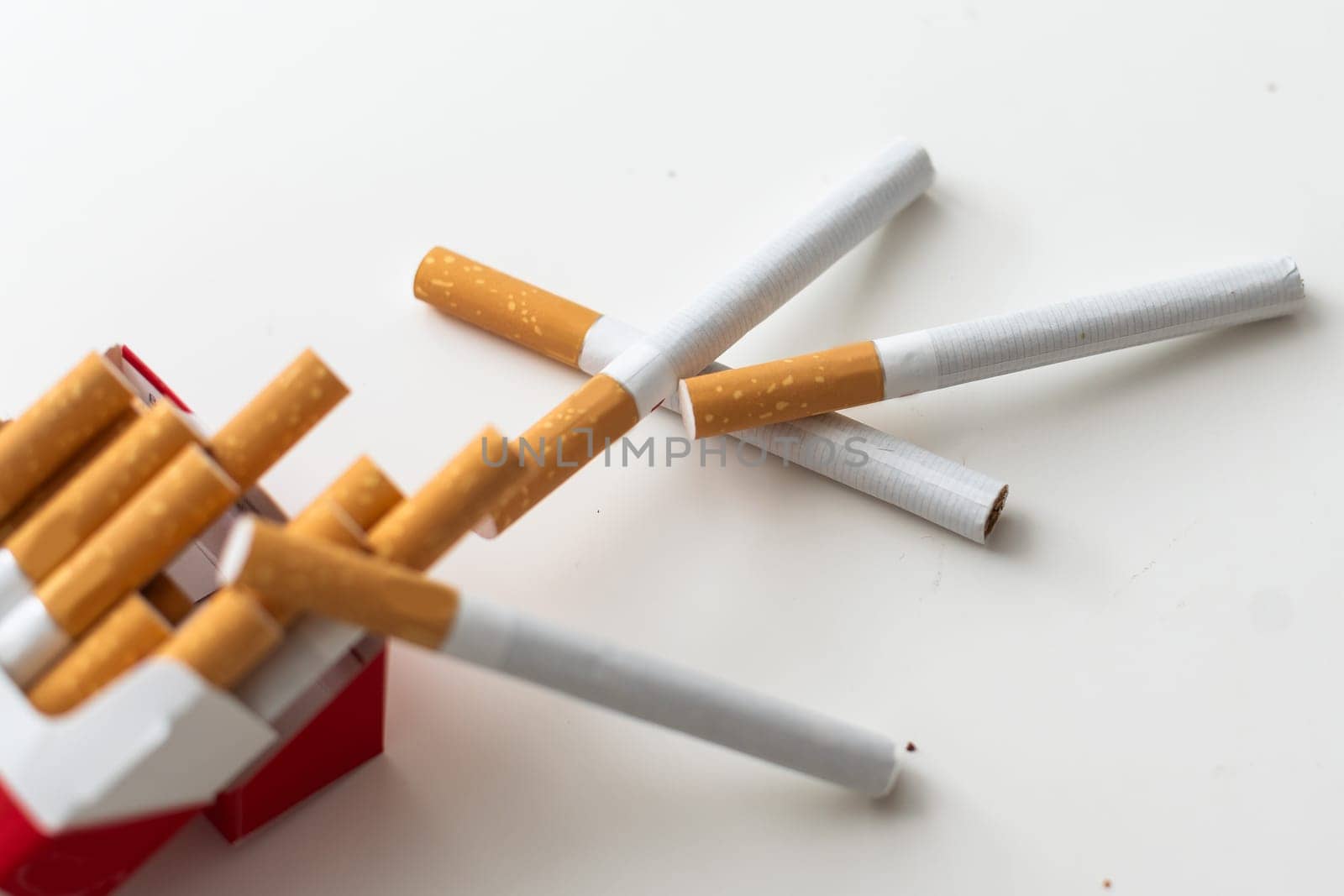 Cigarettes with a yellow filter. Macro shooting. High quality photo