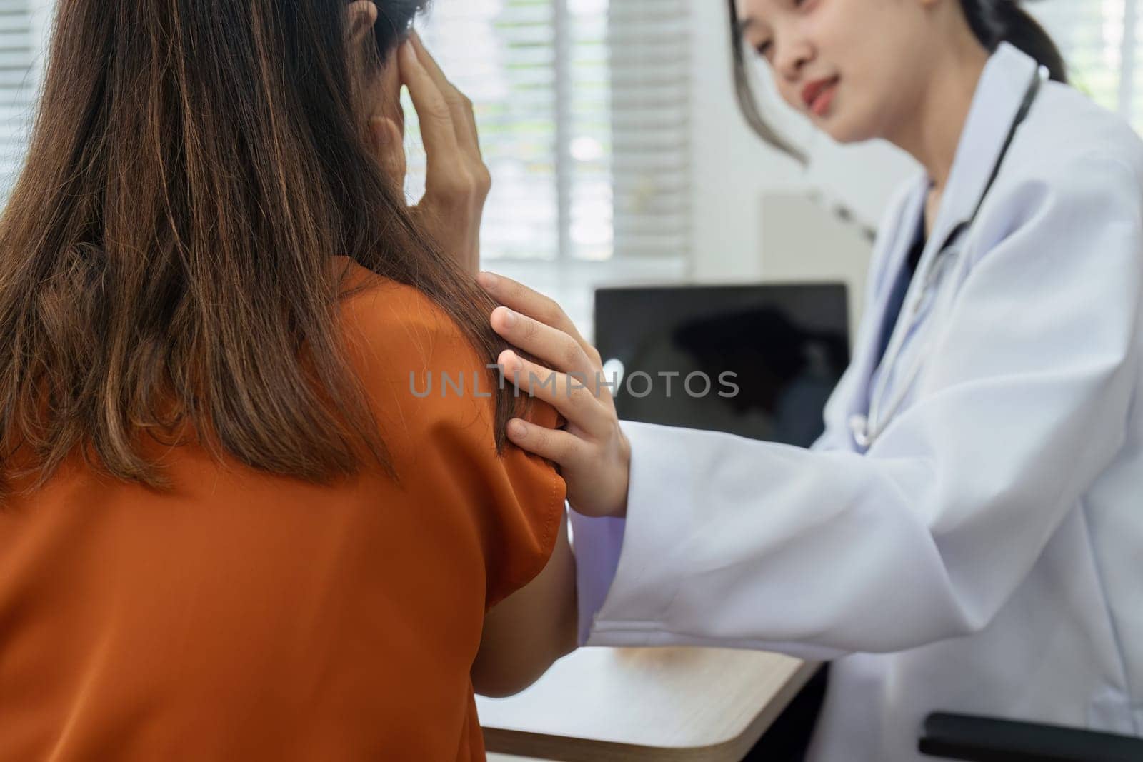 doctor comfort the patient holding shoulder, showing empathy to patient, encouraging patient by itchaznong