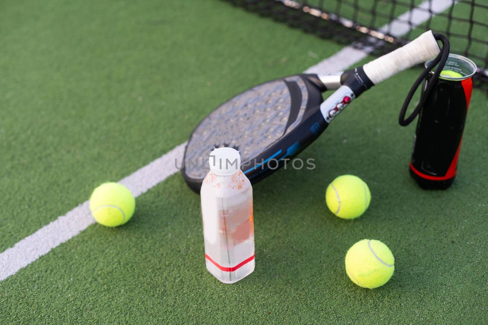 professional paddle tennis racket with natural lighting on court background. Horizontal sport theme poster, greeting cards, headers, website and app. High quality photo
