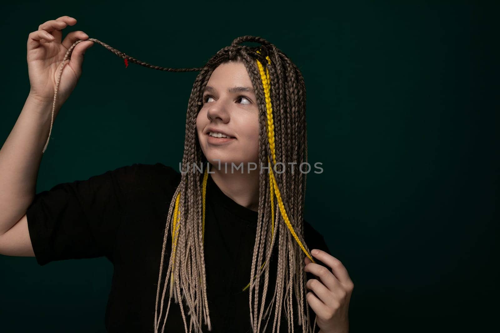 Woman Holding Long Dreadlocks in the Air by TRMK