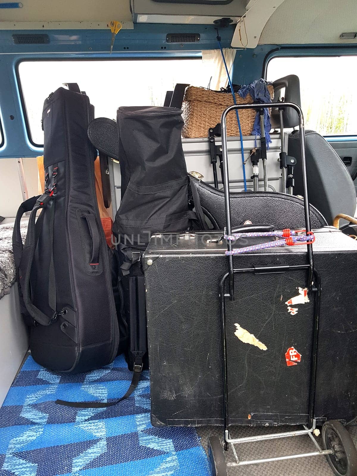 The instruments in the cases are loaded into the van. by Jamaladeen