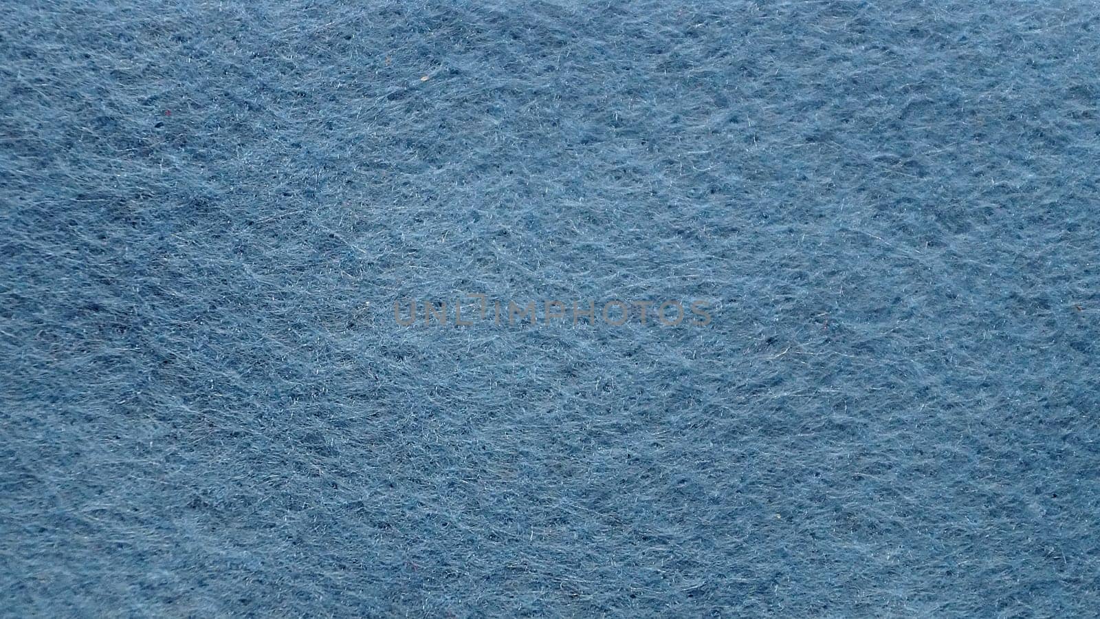 blue felt fabric for textile background close-up