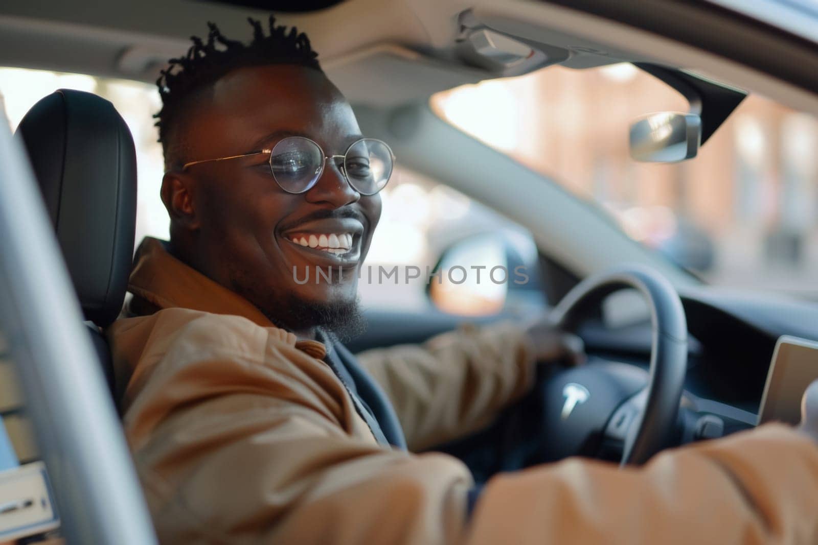 A cheerful African American man beams with satisfaction as he takes a new car for a test drive, enjoying the experience behind the wheel
