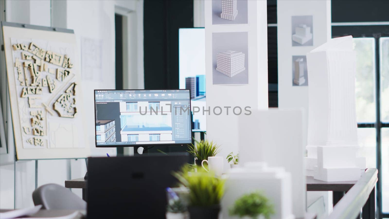 Cad architecture software on computer at empty office desk by DCStudio