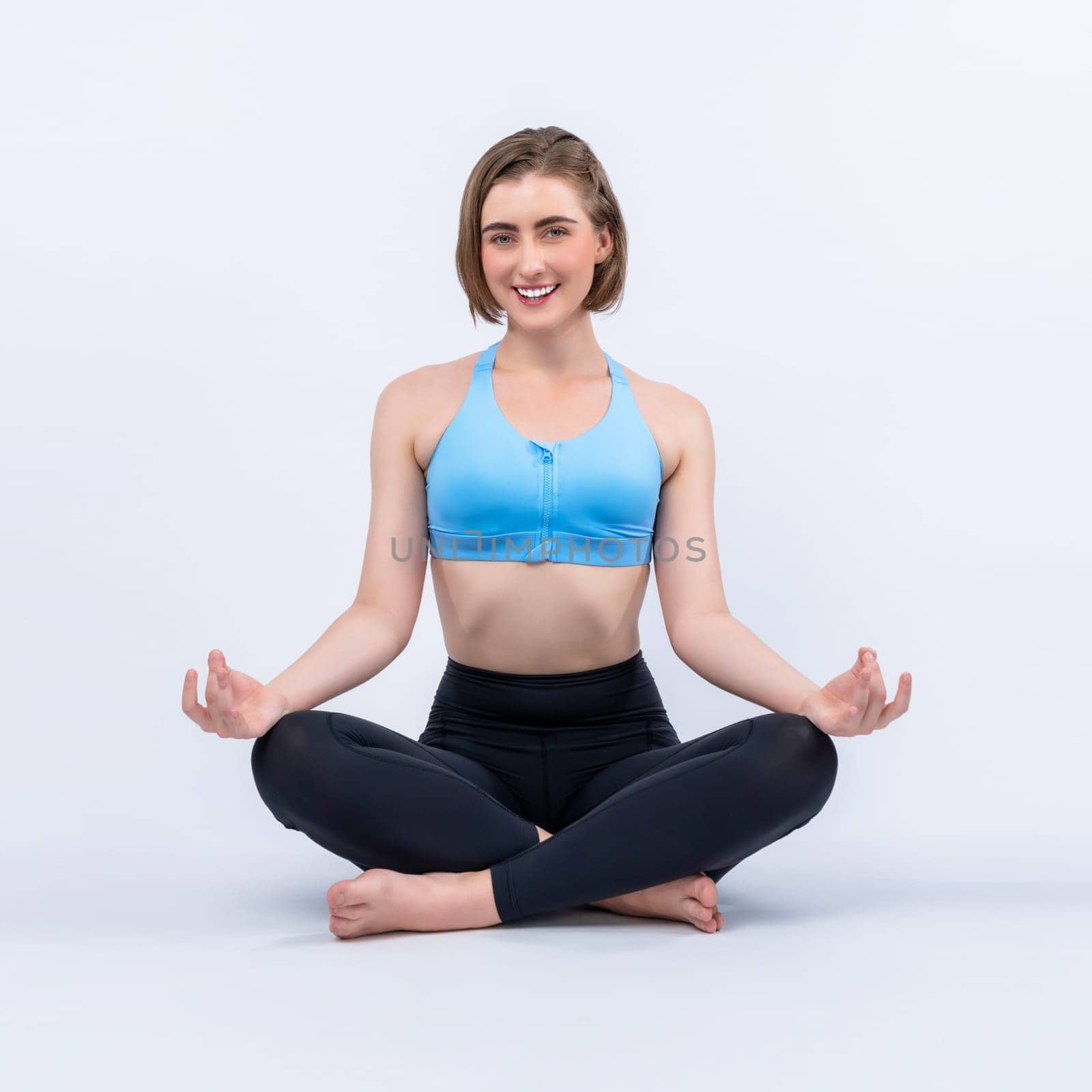 Full body length gaiety shot athletic and sporty woman doing healthy and meditative yoga exercise workout posture on isolated background. Healthy active and body care lifestyle