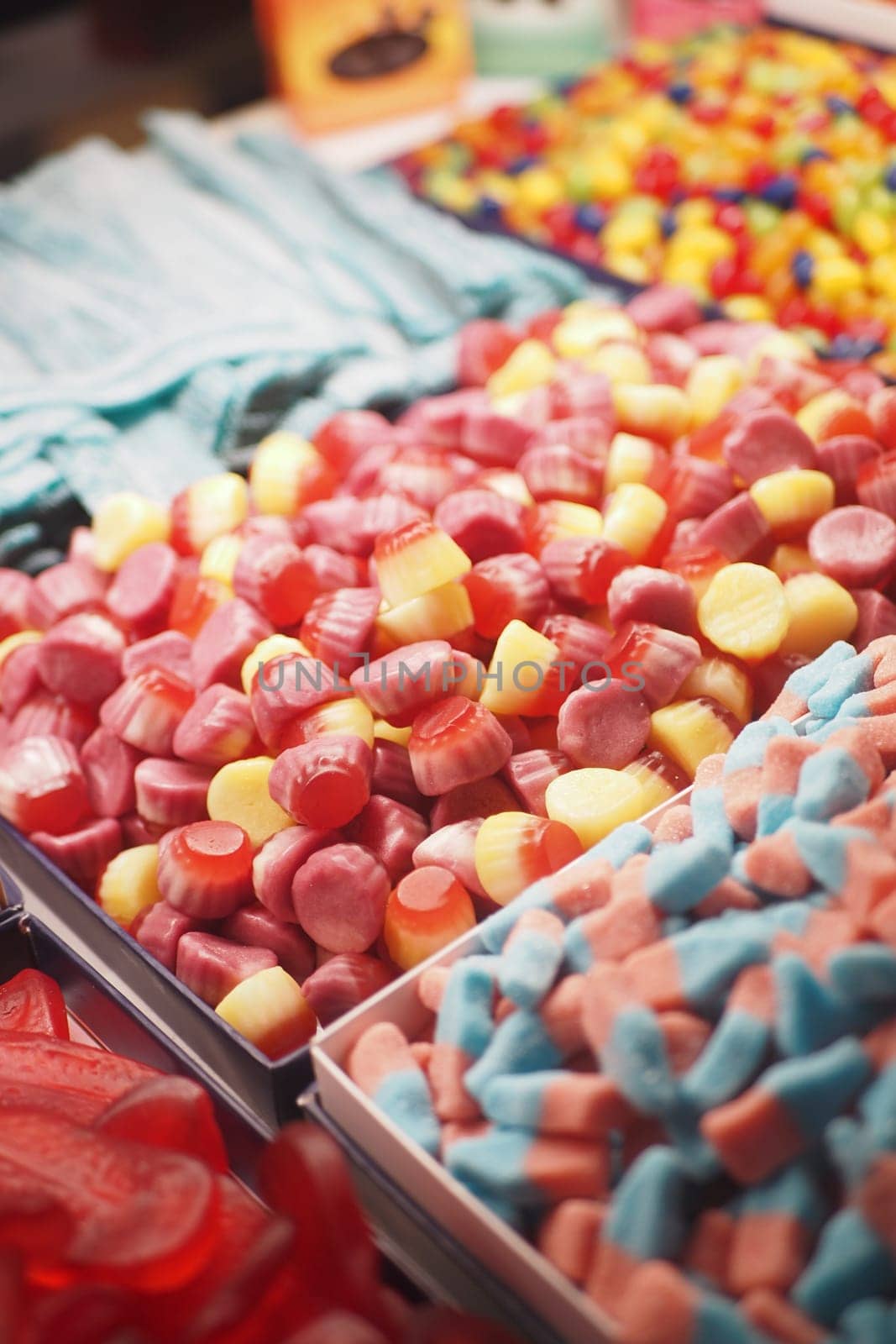 Mixed colorful jelly, gummy candies display for sales by towfiq007