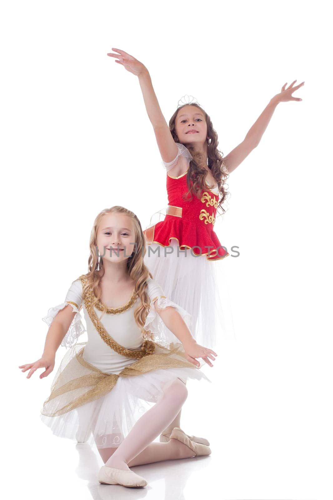 Smiling young ballerinas, isolated on white background