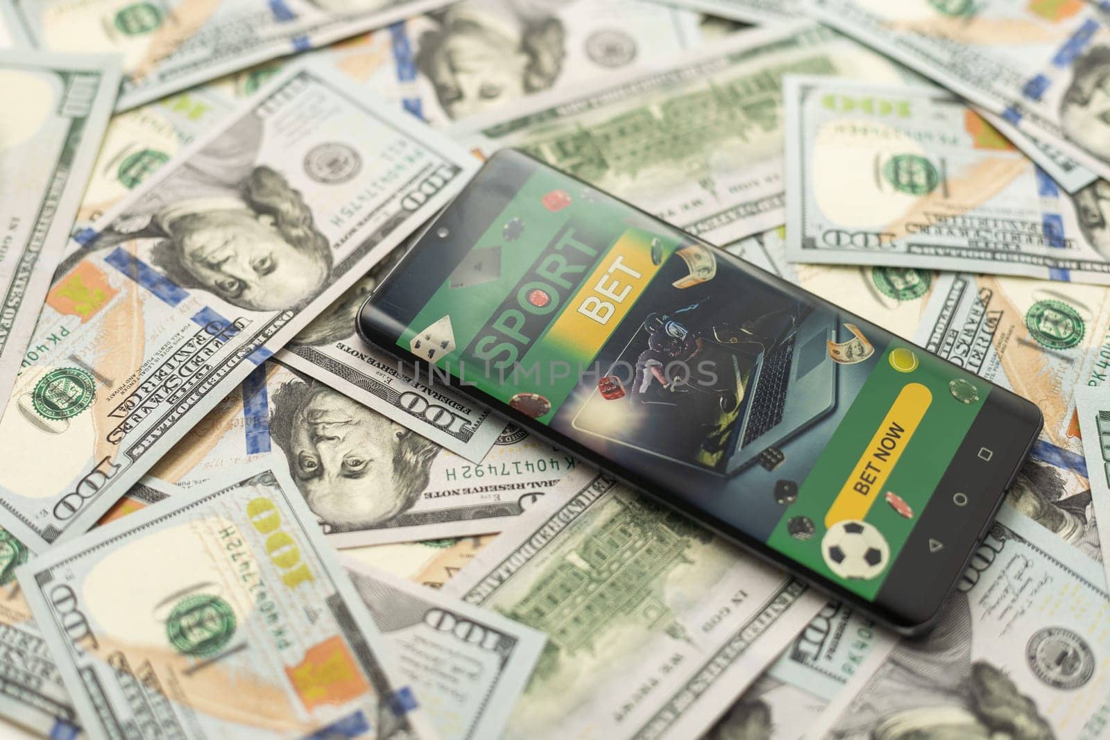 Smartphone with gambling mobile application with money close-up. Sport and betting concept by Andelov13