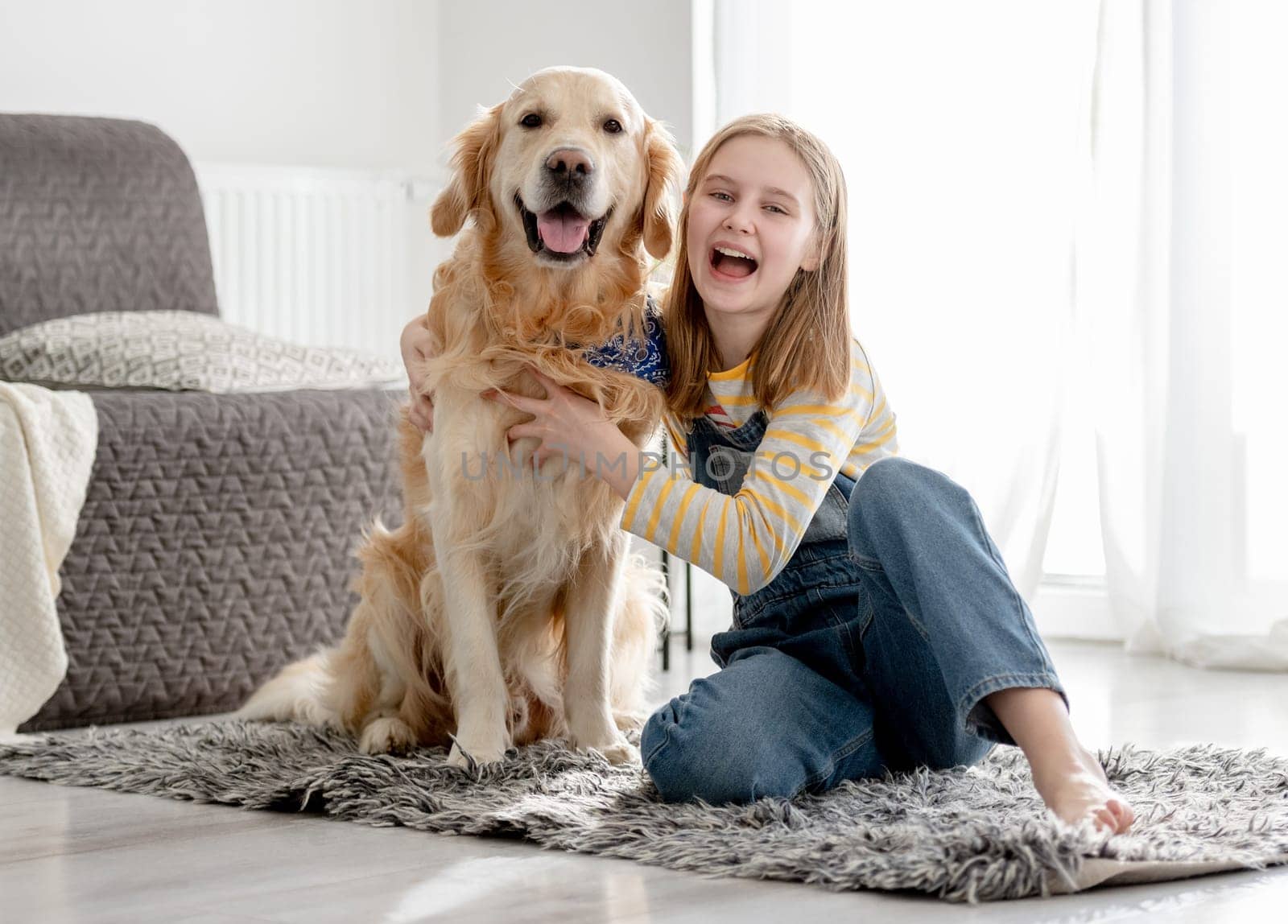 Girl Posing At Home On Floor With Golden Retriever Dog by tan4ikk1