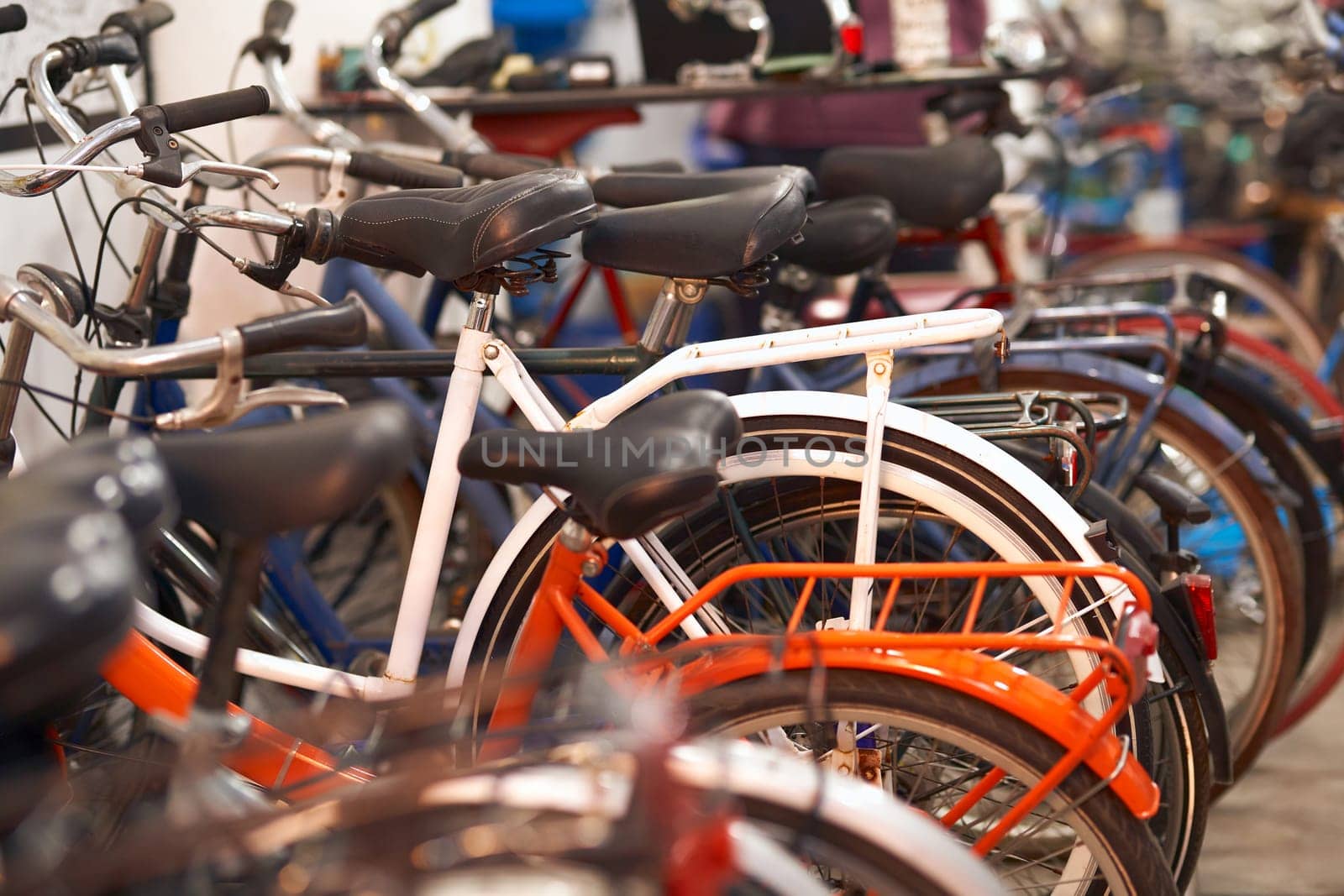 Many different bikes standing in workshop is ready for sale. High quality photo